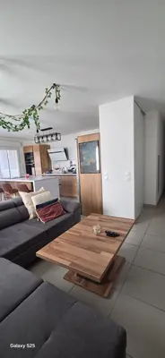 a living room with a couch and a coffee table at T3 Cosy Ajaccio in Ajaccio