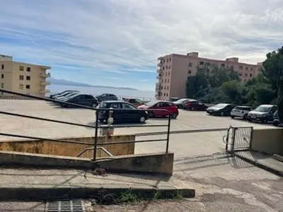 a parking lot with cars parked in a parking lot at Studio AJACCIO Sanguinaires in Ajaccio