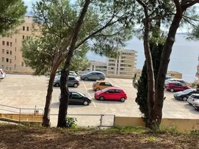 a group of cars parked in a parking lot at Studio AJACCIO Sanguinaires in Ajaccio