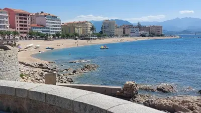 a view of a beach with people in the water at Studio AJACCIO Sanguinaires in Ajaccio