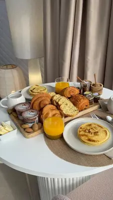 a tray of breakfast foods on a table at Les Dômes du Moulin in Urtaca