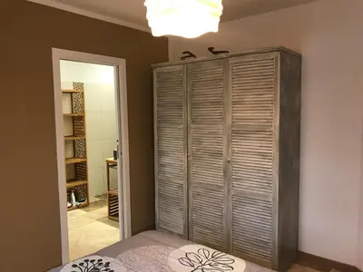 a bedroom with a bed and a large closet at Villa proche de St Florent Corse in Oletta