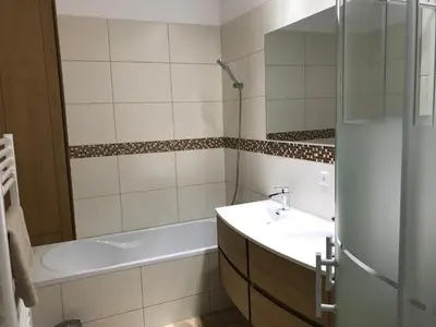 a bathroom with a tub and a sink and a bath tub at Villa proche de St Florent Corse in Oletta