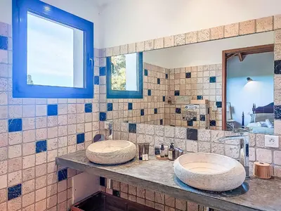 two sinks on a counter in a bathroom at Villa La Dorianzza by Interhome in Porto-Vecchio