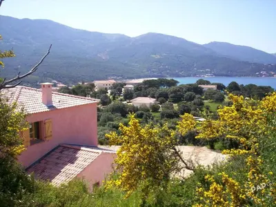 a house with a view of a lake and mountains at Holiday Home Haus in der Nähe von Meer und Bergen- atemberaubende Aussicht- by Interhome in Calcatoggio