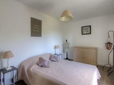 a bedroom with a bed and a chalkboard on the wall at Holiday Home Exklusivität Korsika- Steinhaus mit Charme by Interhome in Santa-Lucia-di-Moriani