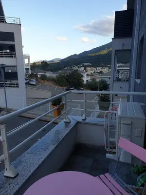 a balcony with a view of a city at Studio récent Corte in Corte