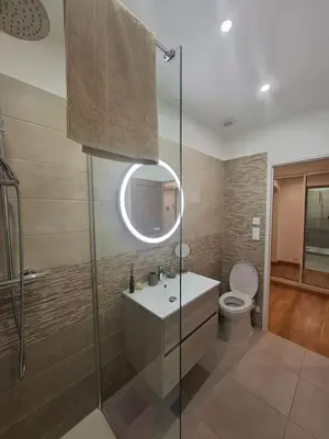 a bathroom with a sink and a toilet at Appartement terrasse au cœur d'Ajaccio in Ajaccio