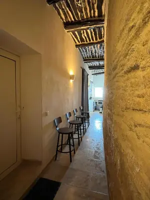a row of chairs in a hallway with a ceiling at Fleur de Falaise in Bonifacio