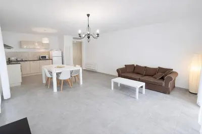 a living room with a couch and a table at Grand F2 avec terrasse spacieuse, Centre Corte in Corte