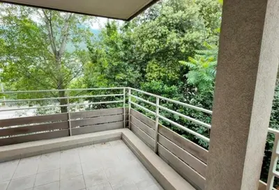 an outdoor balcony with a view of trees at Grand F2 avec terrasse spacieuse, Centre Corte in Corte