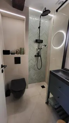 a bathroom with a shower and a toilet and a sink at Studio de charme Cœur d'Ajaccio in Ajaccio