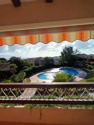 a view of a swimming pool from a balcony at CORSE Bravone bel appart à 2 pas de la plage 2ch et mezzanine in Linguizzetta
