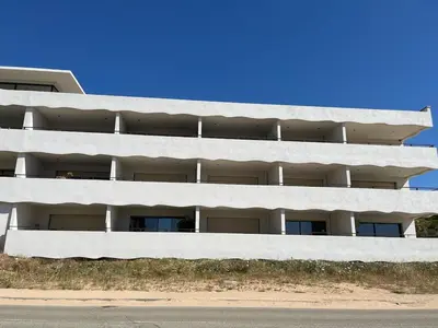 a white apartment building with balconies on the side of it at Loc A Machia Fiurita 2 - Vue mer in Pietrosella