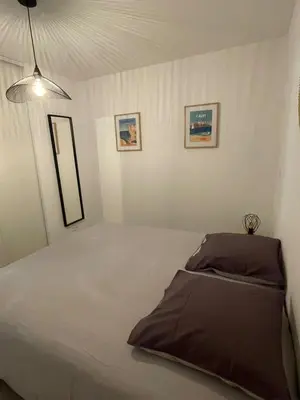 a bedroom with a large bed in a room at Loc A Machia Fiurita 2 - Vue mer in Pietrosella