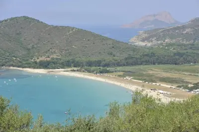 a view of a beach from a hill at Chalet 3 étoiles - Parc aquatique - ccbegba in Cargèse