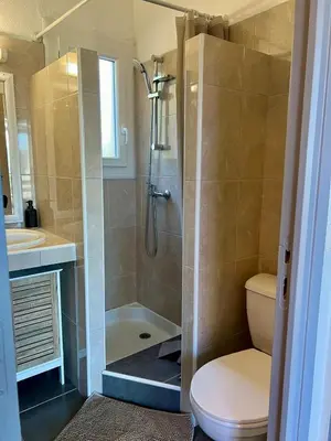 a bathroom with a shower with a toilet and a sink at Luce di Mare Studio - Near Santa-Giulia in Porto-Vecchio