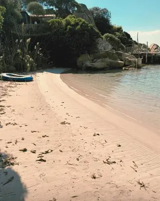 a beach with a blue boat sitting on the sand at Private pool villa Beach 50 m away 10 guests in Sartène