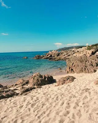 a wooden deck with a view of the ocean at Private pool villa Beach 50 m away 10 guests in Sartène