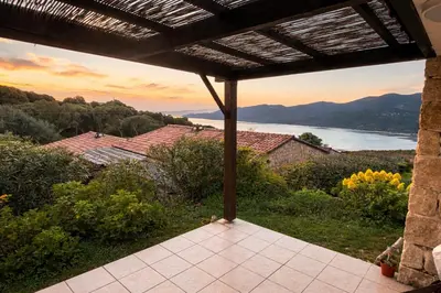 a view from the porch of a house with a view at Mini-villa 4 personnes - Soléa 19 - vue mer in Serra-di-Ferro