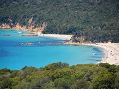 a beach with a group of people in the water at Mini-villa 4 personnes - Soléa 19 - vue mer in Serra-di-Ferro