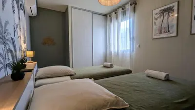 a bedroom with two beds and a window at T3 Casa di Giulia neuf grande terrasse - Lumineux - Plage à 5 min in Zonza