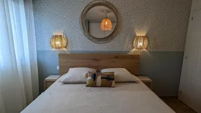 a bedroom with a bed with two bags on it at T3 Casa di Giulia neuf grande terrasse - Lumineux - Plage à 5 min in Zonza