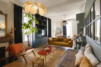 an open door to a patio with a table and a chair at Charmant appartement centre Ajaccio in Ajaccio
