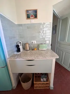 a kitchen with a counter with a appliance on it at Elegant 2-bedroom terrace in the heart of the city in Ajaccio