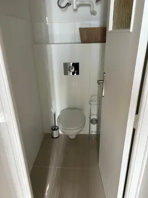 a small white bathroom with a toilet in it at T2 Cosy Centre Ajaccio in Ajaccio