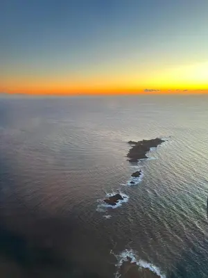 an island in the middle of the water at sunset at Casa Alivu in Pietrosella