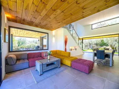 a living room with a couch and a table at Villa Diciottu in Porto-Vecchio