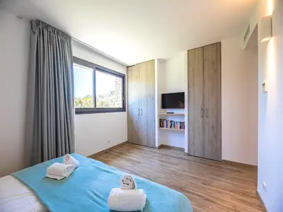 a bathroom with a sink and a shower and a mirror at Villa Diciottu in Porto-Vecchio