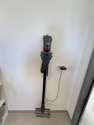 a robot is attached to a white wall at Villa mitoyenne - Luxury house between sea and nature in Ghisonaccia