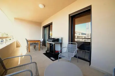 a room with a balcony with a table and chairs at Résidence Poggiarelli in Sainte-Lucie de Porto-Vecchio