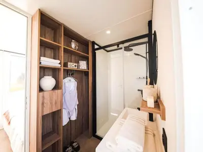 a small bathroom with a glass shower in a room at Bungalow cosy avec terrasse - 2 pers. - API-1-52-1974 in Linguizzetta