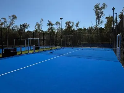 a tennis court with two tennis nets on it at Bungalow cosy avec terrasse - 2 pers. - API-1-52-1974 in Linguizzetta