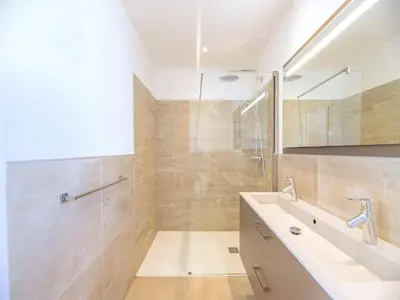 a bathroom with a bath tub and a window at Villa Dicianove in Porto-Vecchio
