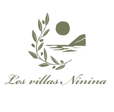 a bird sitting on a branch with the sun and text less wildlifewana at Villa Ninina in Alata