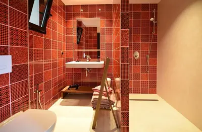 a bathroom with a sink and a toilet at Appart'hotel Fior Di Ribba in Sartène