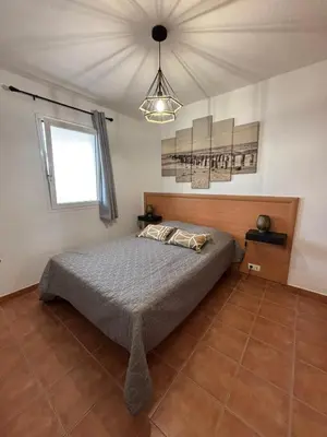 a bedroom with a bed and a ceiling at Vacances idéales in San-Nicolao