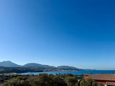 a view of the water and mountains at Maison 4 chambres vue mer Jardin et plage à 1 min in Olmeto
