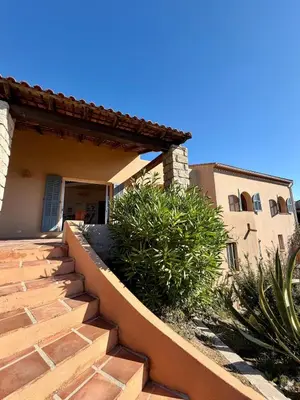 a set of stairs leading to a house at Maison 4 chambres vue mer Jardin et plage à 1 min in Olmeto