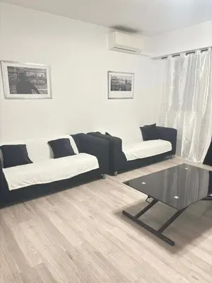 a living room with two couches and a coffee table at Ajaccienne in Ajaccio