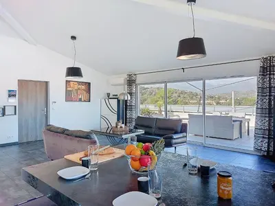a living room with a table with fruit on it at Apartment La Boétie by Interhome in Porto-Vecchio