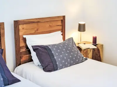 a bedroom with a bed with a pillow and a lamp at Holiday Home Anna Maria by Interhome in Porto-Vecchio