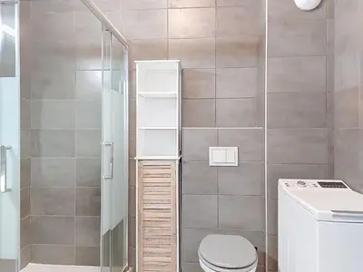a small bathroom with a toilet and a shower at Studio Studio Côté Sud 5 by Interhome in Porto-Vecchio