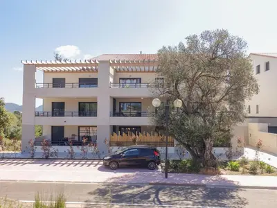 a car parked in front of a building at Studio Studio Côté Sud 5 by Interhome in Porto-Vecchio