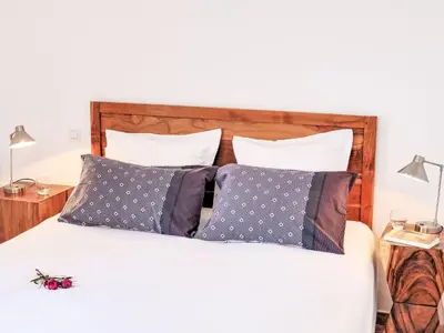 a bedroom with a bed with pillows at Holiday Home Quenza by Interhome in Porto-Vecchio