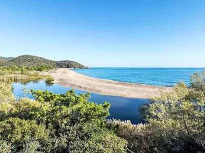 a view of the ocean from a bluff at Apartment Bas Casa Blue by Interhome in Sainte-Lucie de Porto-Vecchio